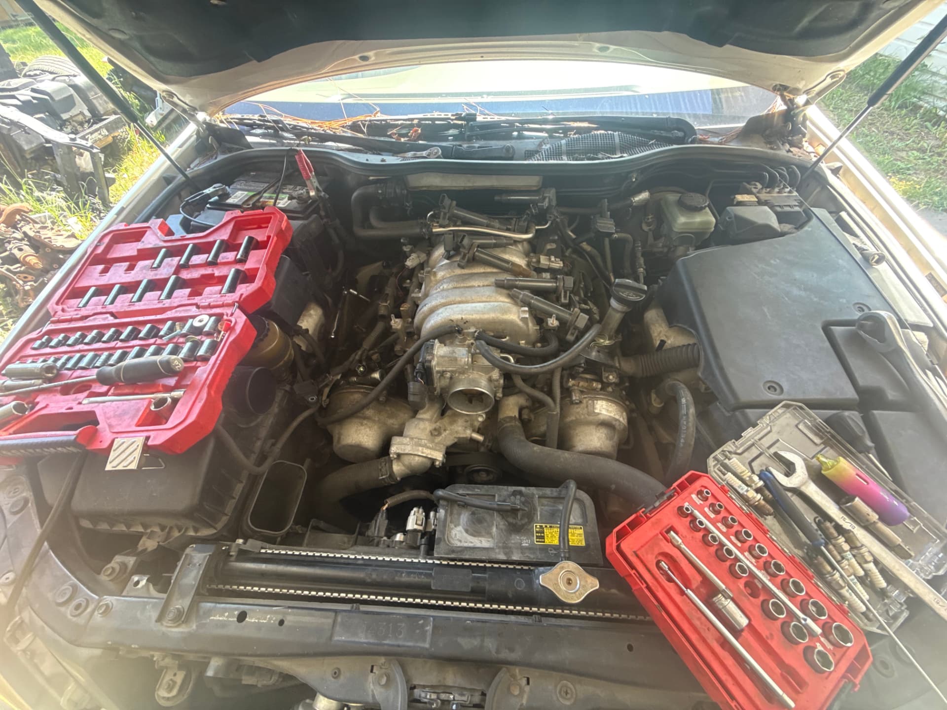 Blake's tools laid out over an open engine bay in Douglas, GA